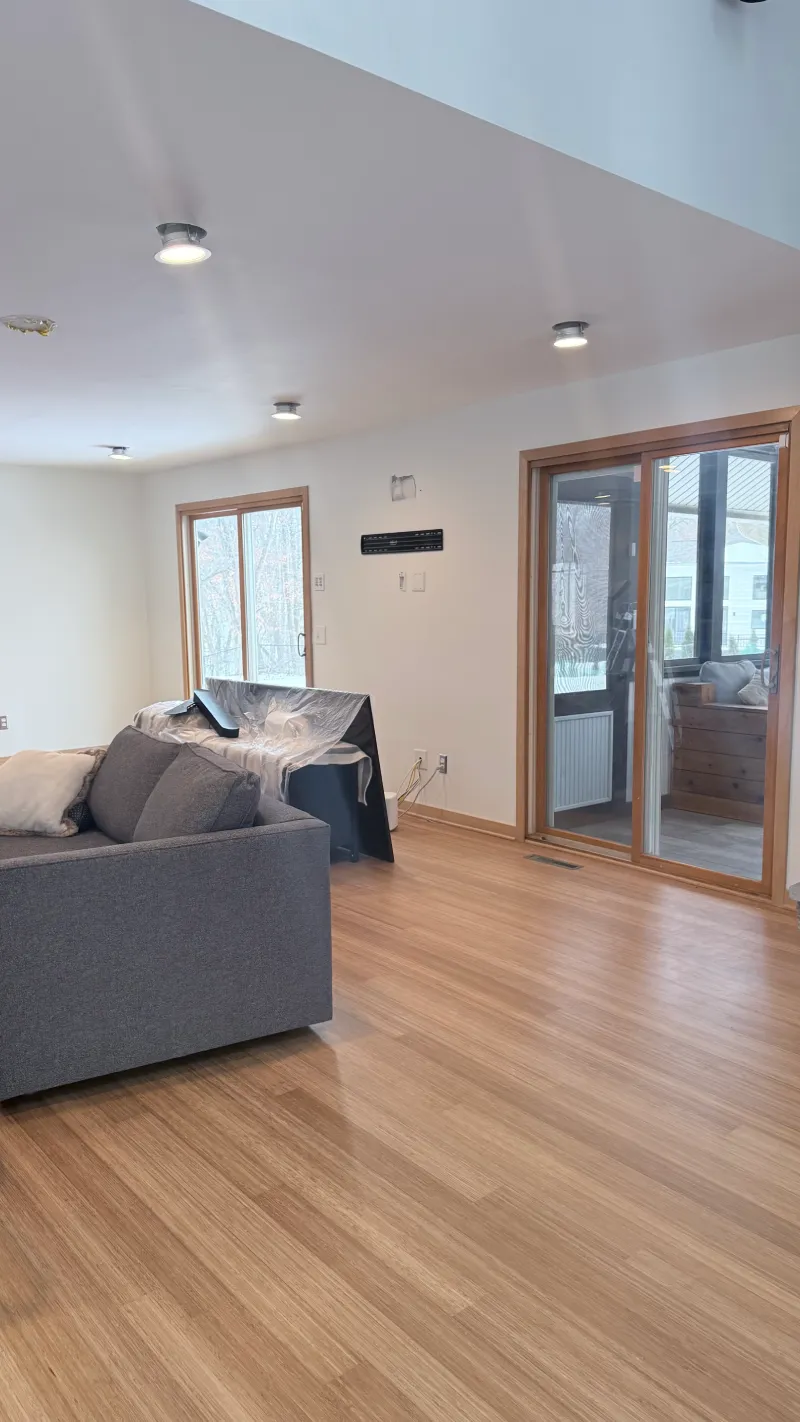 Interior painting preparation with protected floors before ceiling painting
